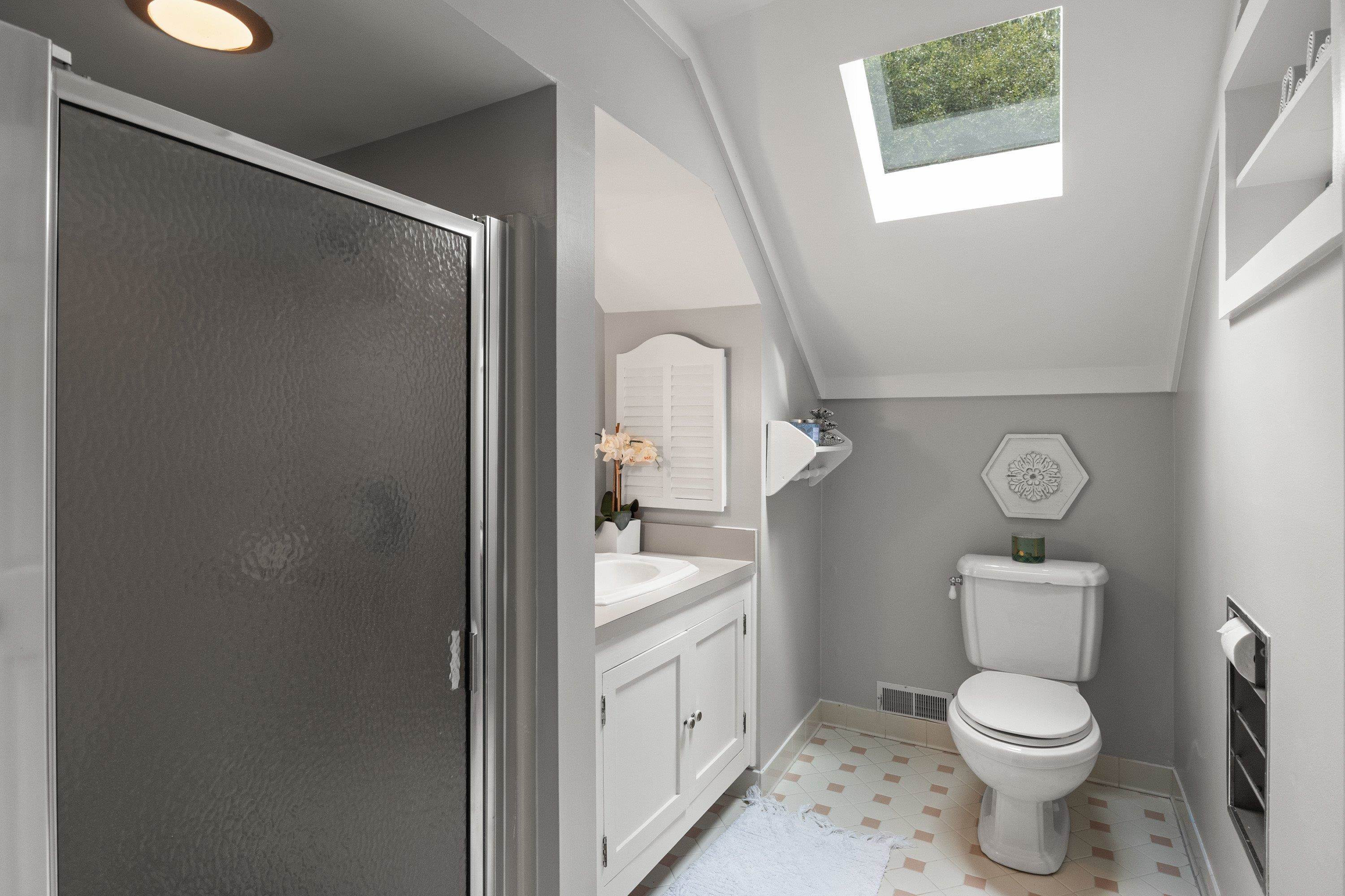 2420 Windsor Trail Raleigh, NC 27615 - Photo 46 of 72 a bathroom with a toilet a sink and a shower