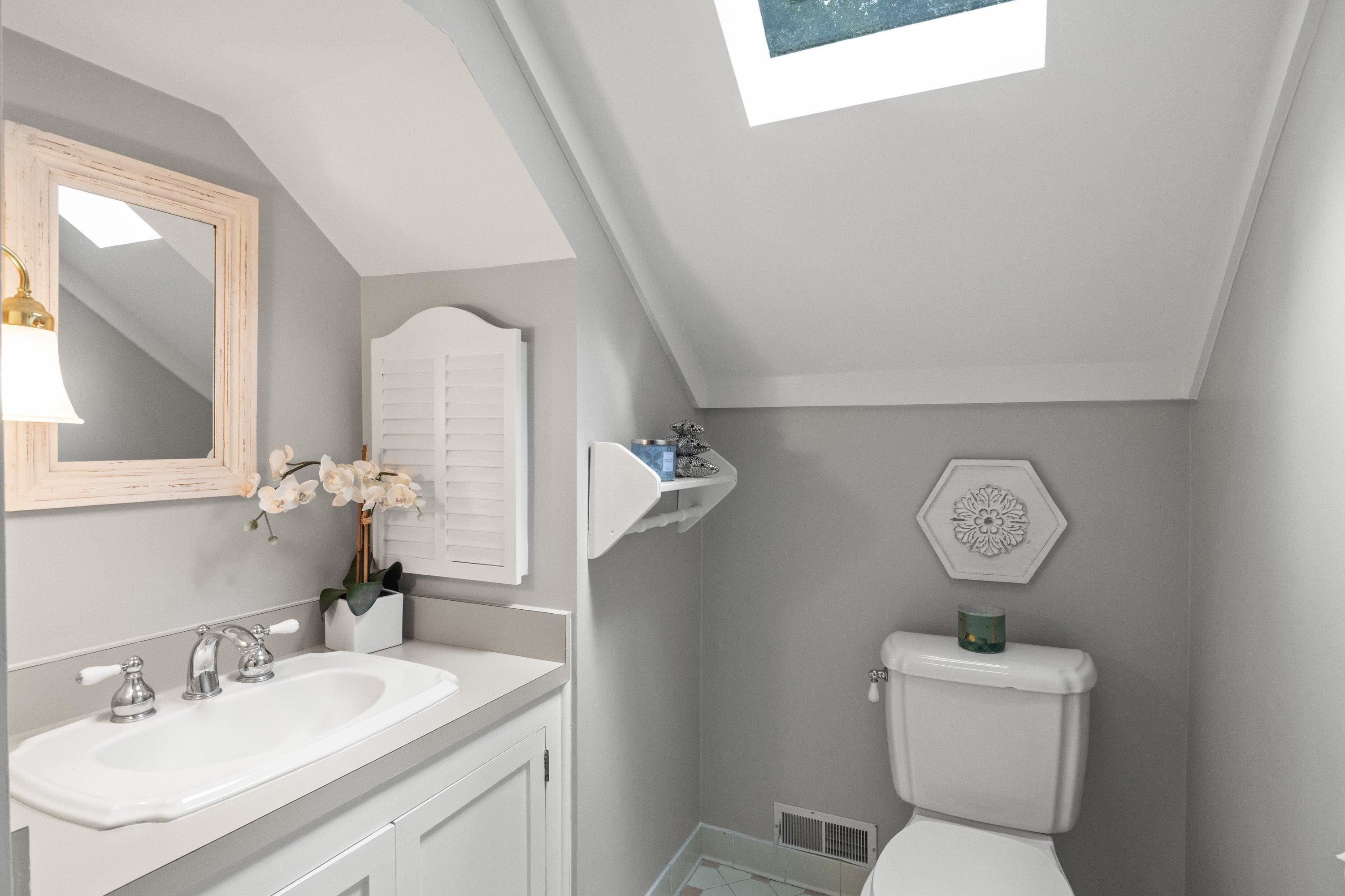 2420 Windsor Trail Raleigh, NC 27615 - Photo 47 of 72 a bathroom with a toilet sink vanity and mirror