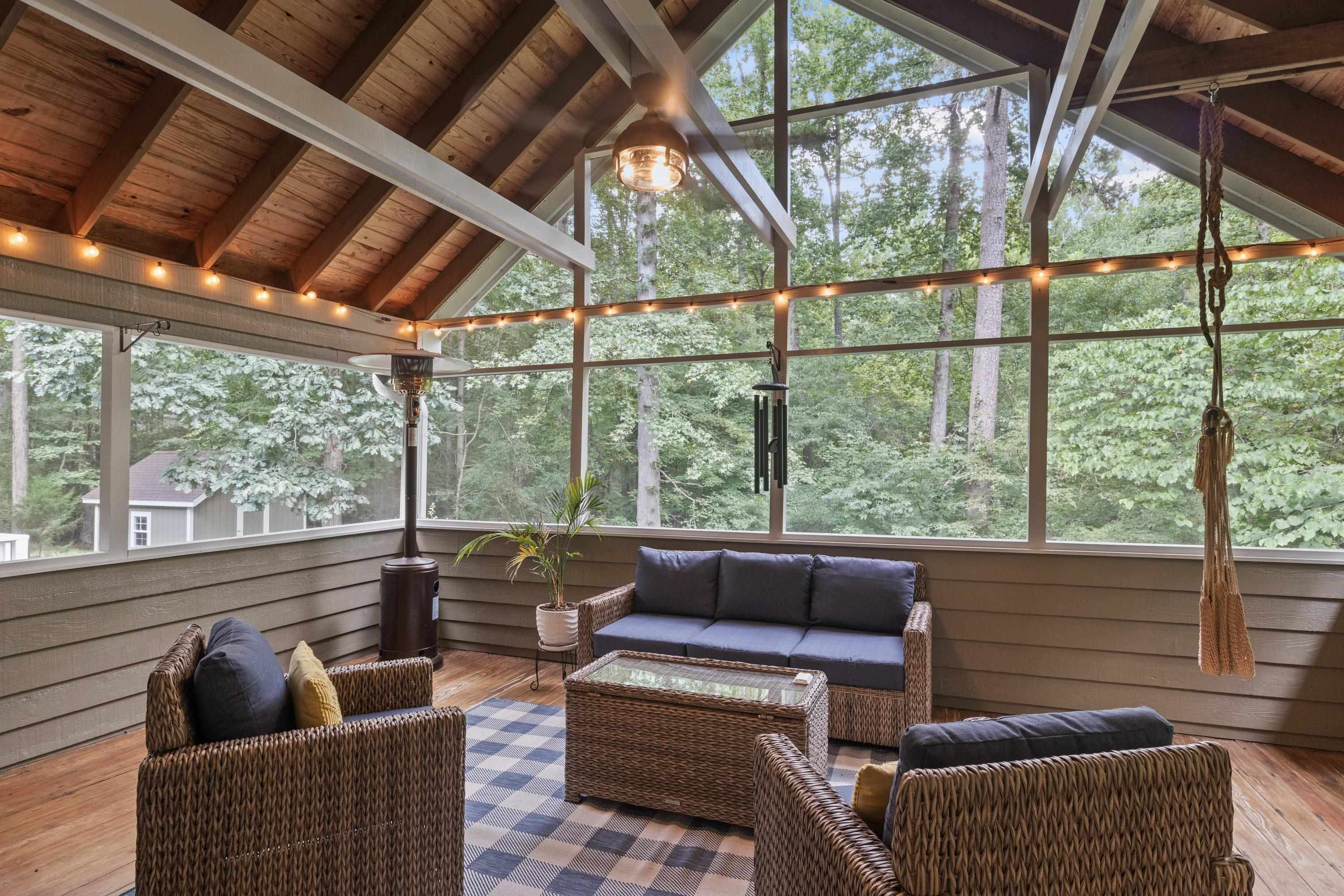 2420 Windsor Trail Raleigh, NC 27615 - Photo 49 of 72 a living room with furniture and a floor to ceiling window