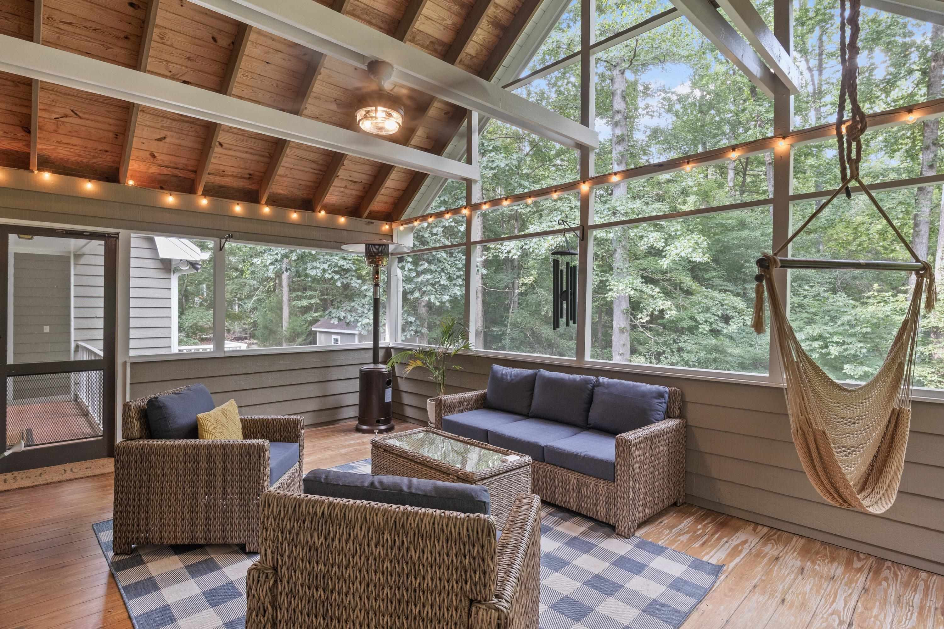 2420 Windsor Trail Raleigh, NC 27615 - Photo 50 of 72 a living room with furniture and a floor to ceiling window