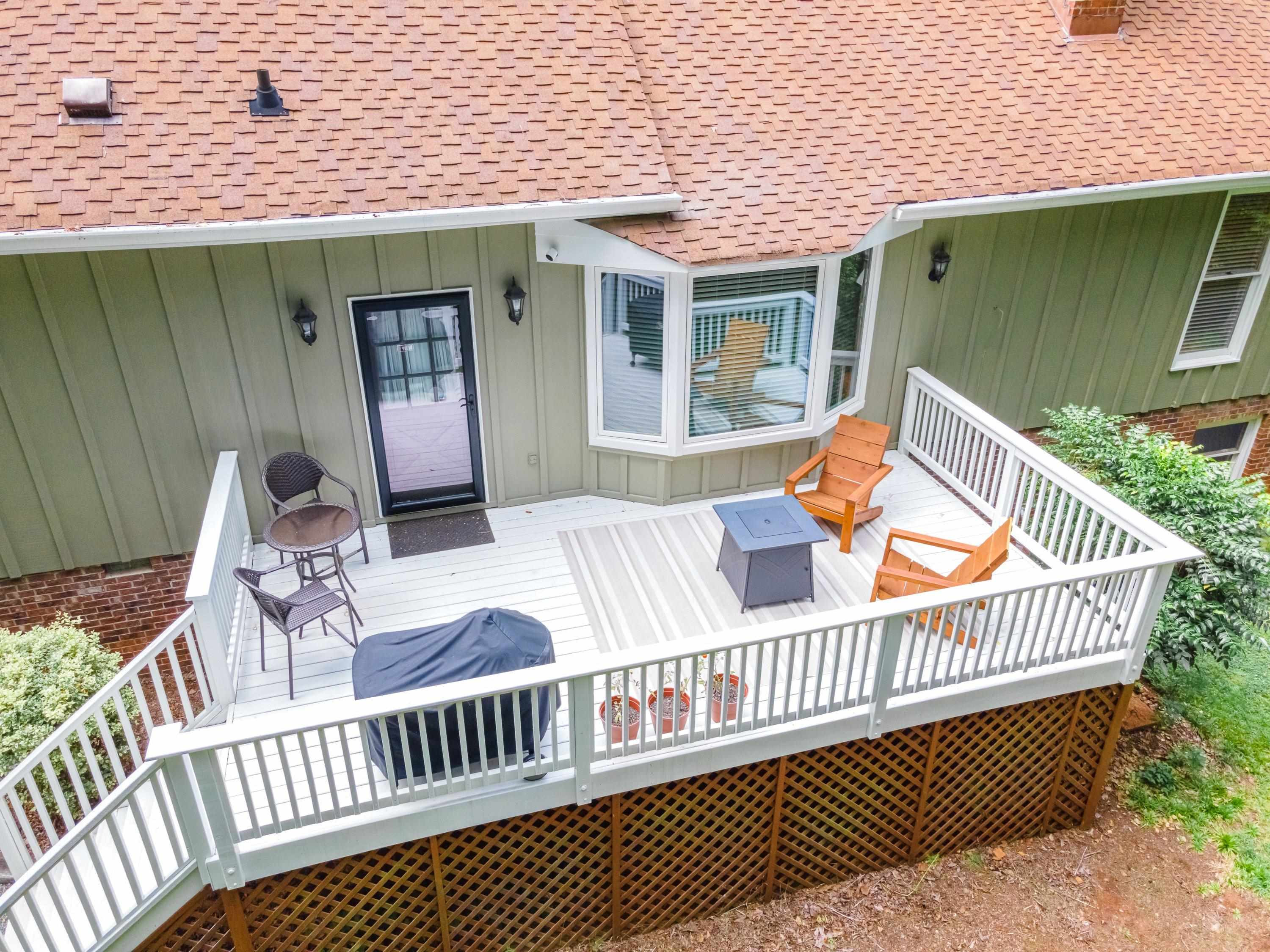 2420 Windsor Trail Raleigh, NC 27615 - Photo 56 of 72 a view of a wooden deck with a patio