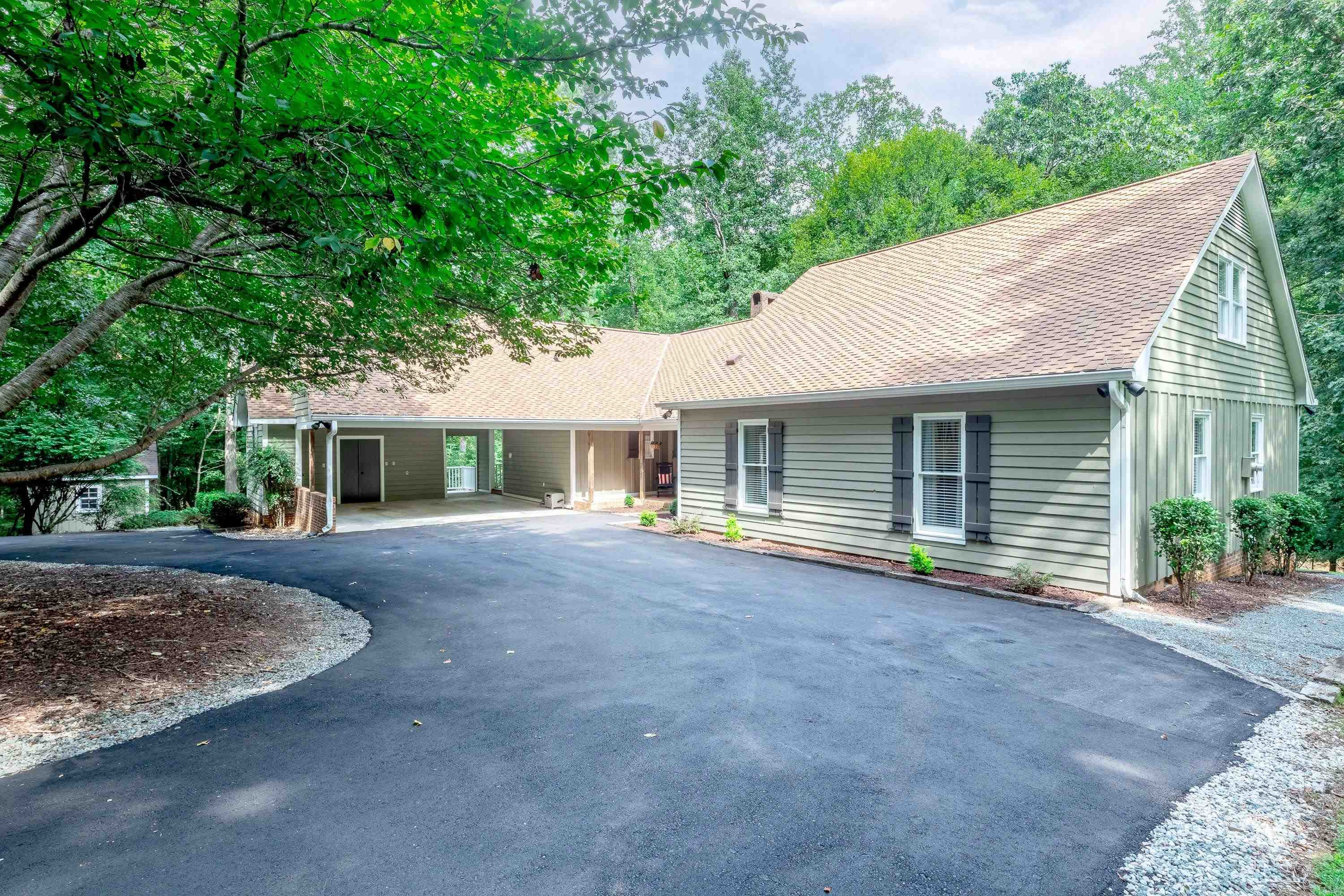 2420 Windsor Trail Raleigh, NC 27615 - Photo 57 of 72 a front view of a house with a yard and outdoor seating