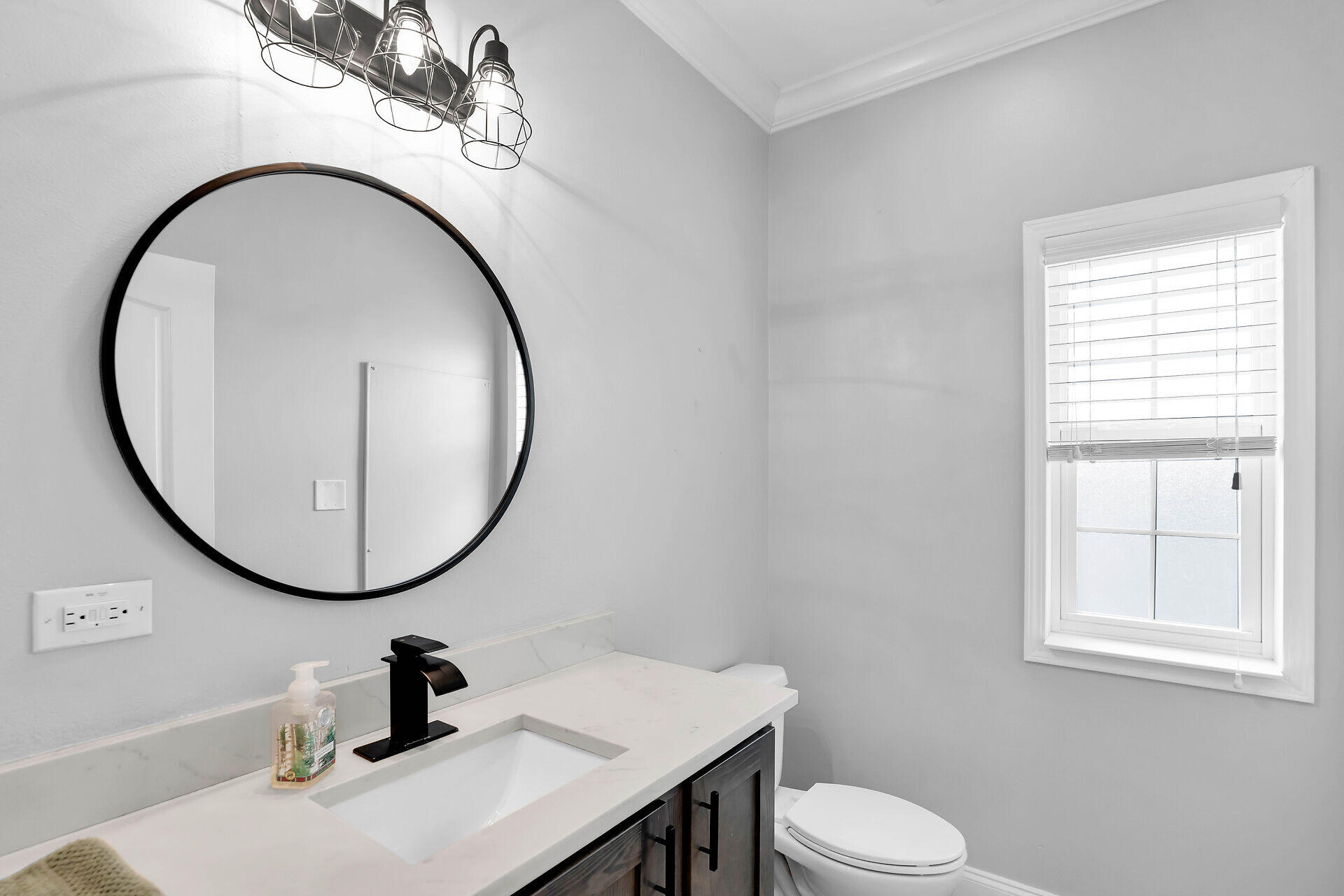 59 Ed Swift Road Key West, FL 33040 - Photo 8 of 35 a bathroom with a sink a mirror and a toilet