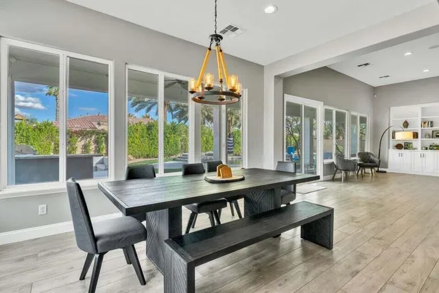 a dining room with a large window and table