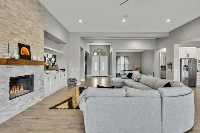 a living room with furniture and a fireplace