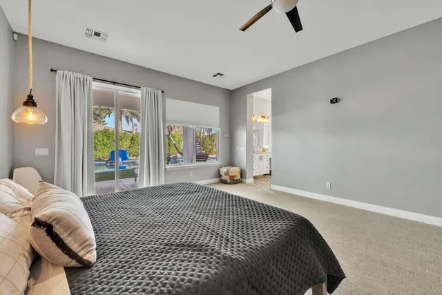 a large bathroom with a double vanity sink mirror and bathtub