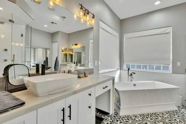 a bathroom with a shower and a sink