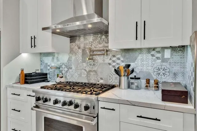 a white stove top oven sitting inside of a kitchen