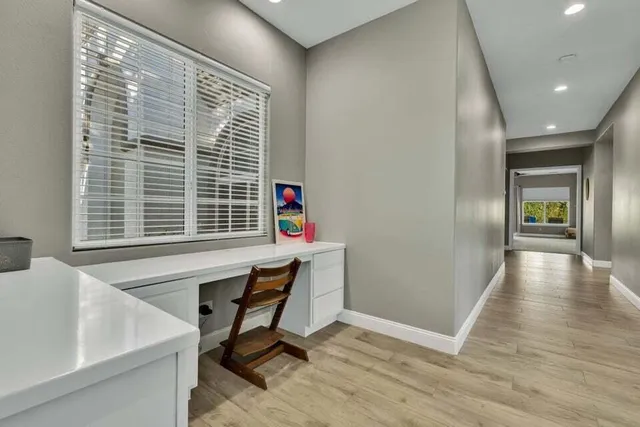 a bedroom with a bed and a desk