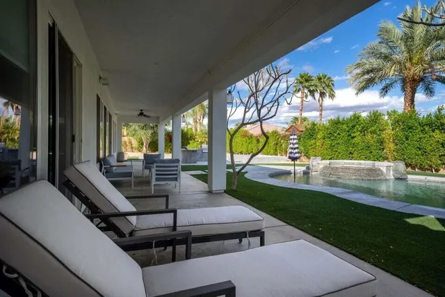 a view of a terrace with couches and potted plants