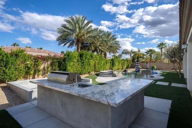 a view of a swimming pool with a yard