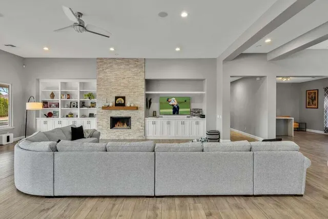 a living room with furniture and a fireplace