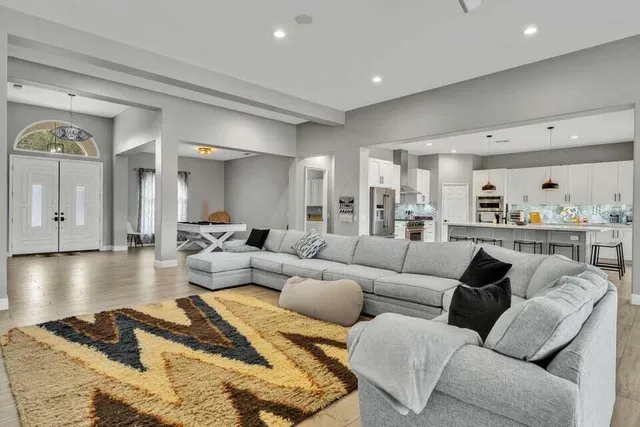 a bedroom with a bed and chair