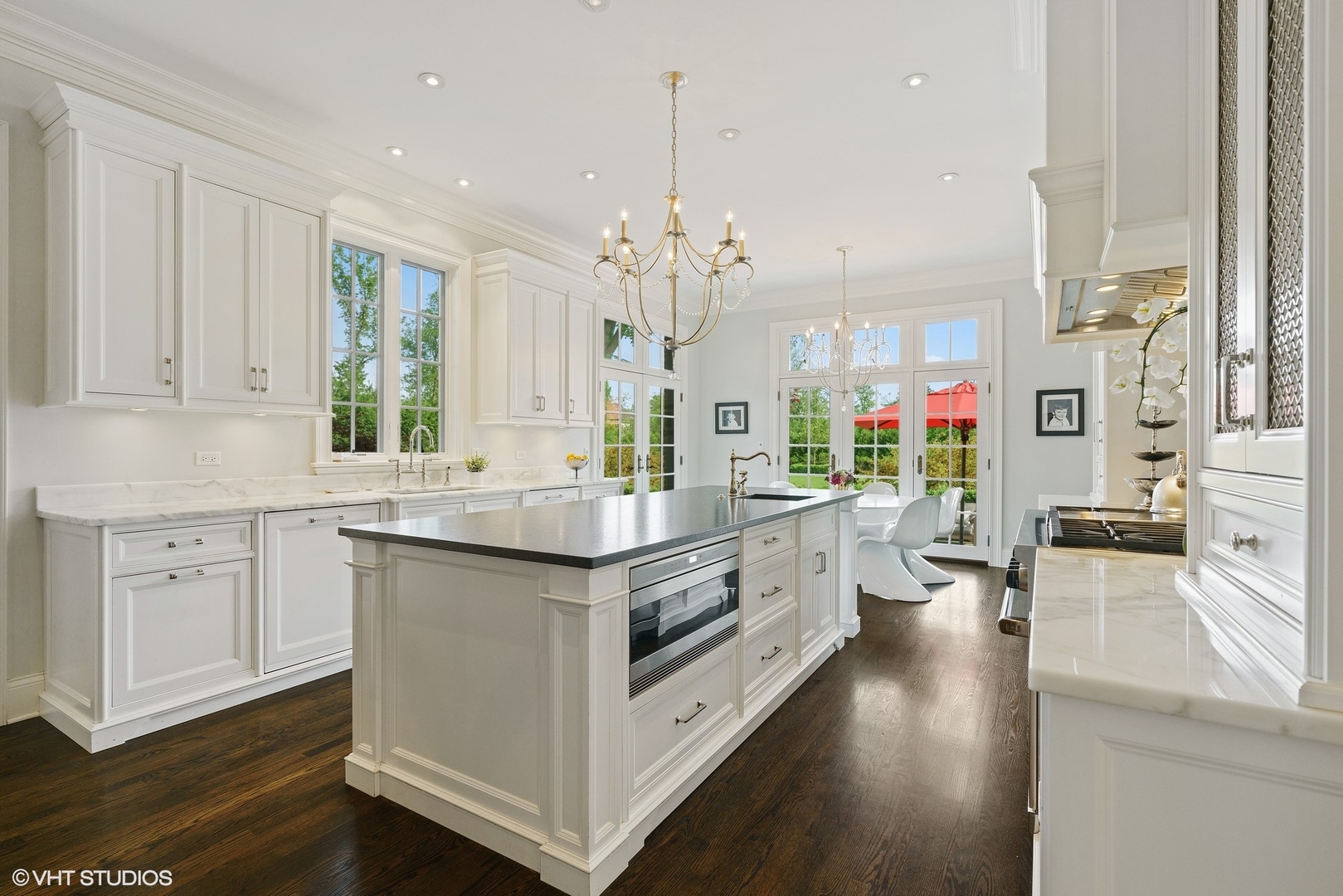 345 West Onwentsia Road Lake Forest, IL 60045 - Photo 12 of 53 a large kitchen with kitchen island white cabinets and stainless steel appliances