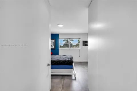 a hallway with a couch and cabinets