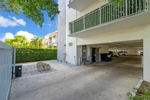 a view of a house with porch and furniture
