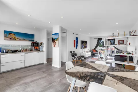 a living room with furniture kitchen view and kitchen view