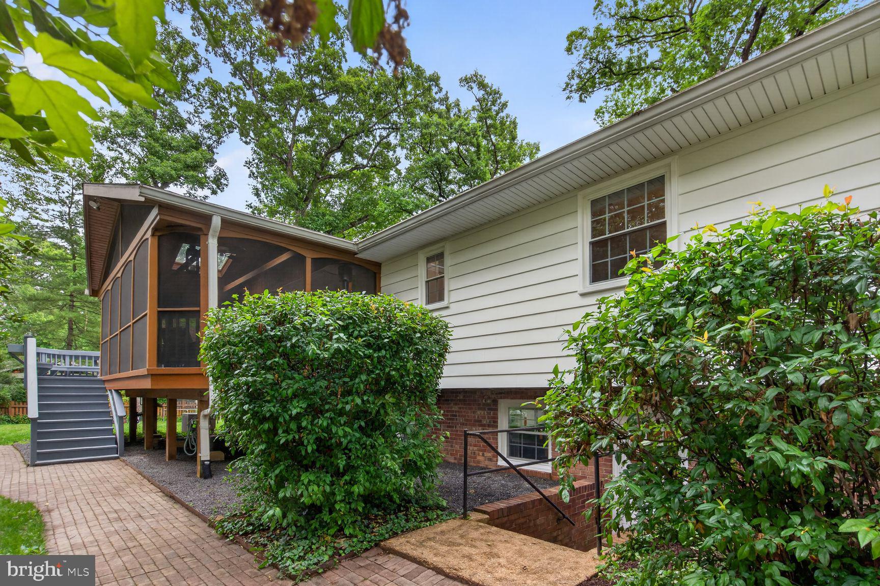5024 Portsmouth Road Fairfax, VA 22032 - Photo 29 of 38 a wooden bench sitting in front of a house
