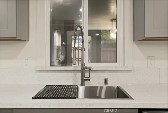 a view of a livingroom with wooden floor and window