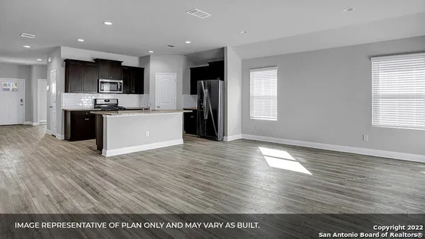 a view of a kitchen with microwave and cabinets