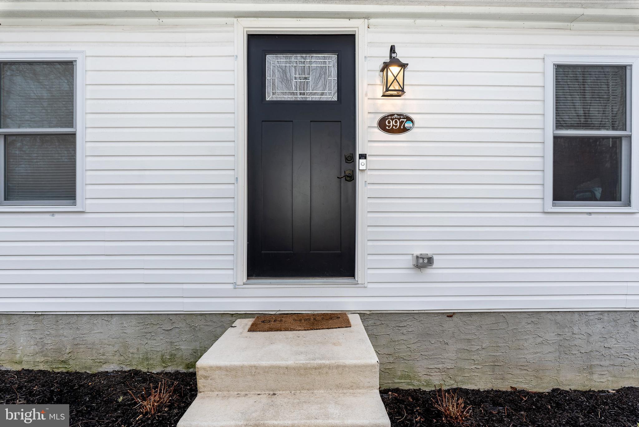 997 Williamstown Road Franklinville, NJ 08322 - Photo 1 of 62 a white house with a door and wooden door