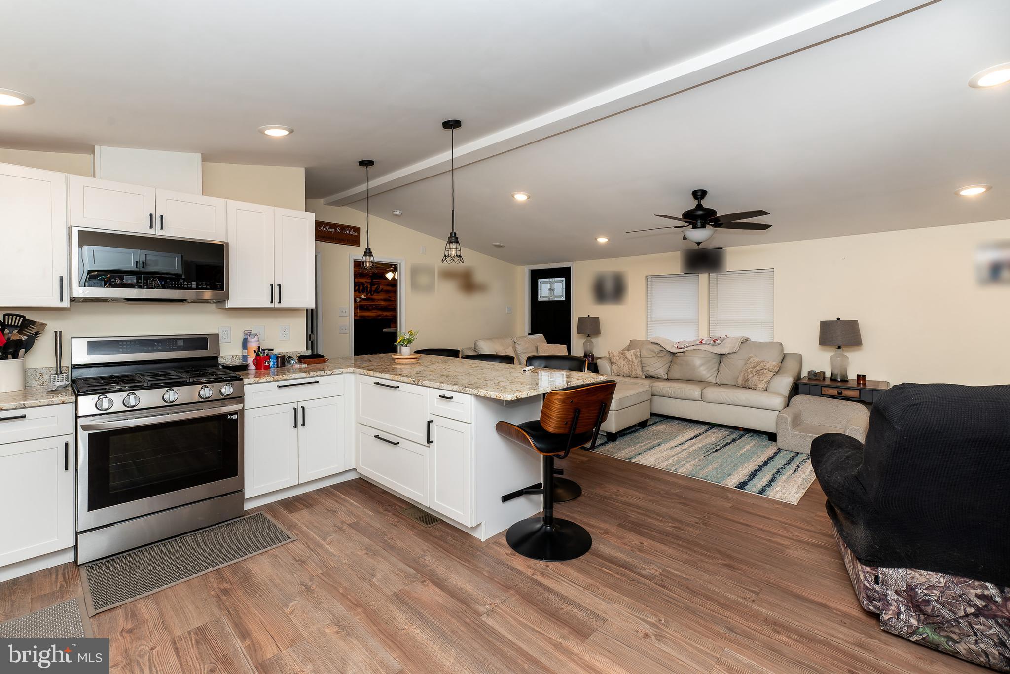 997 Williamstown Road Franklinville, NJ 08322 - Photo 16 of 62 a living room with stainless steel appliances furniture and a kitchen view