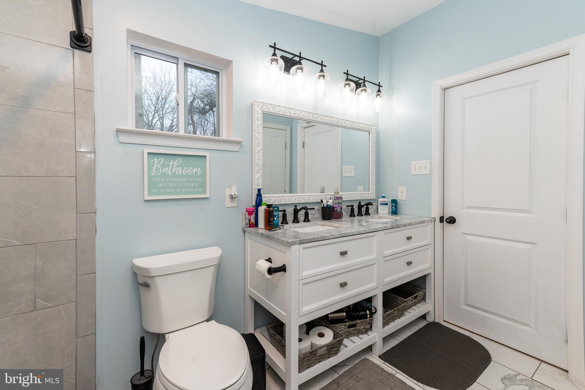 997 Williamstown Road Franklinville, NJ 08322 - Photo 26 of 62 a bathroom with a toilet a sink and mirror