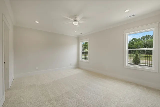an empty room with windows and closet