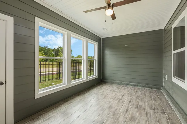 a view of a house with backyard and a garden