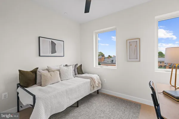 a bedroom with a bed and a chair