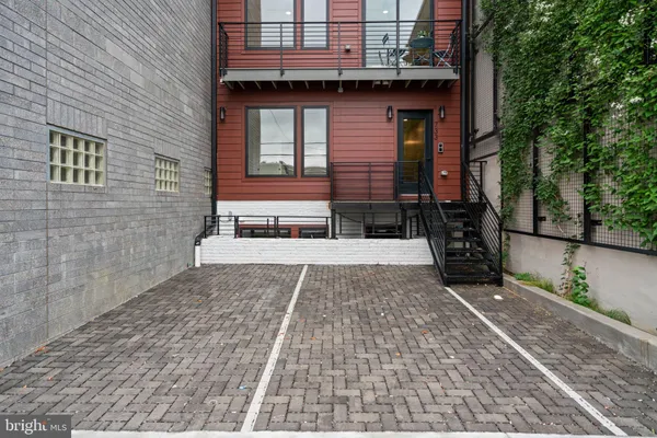 a backyard of a house with outdoor seating