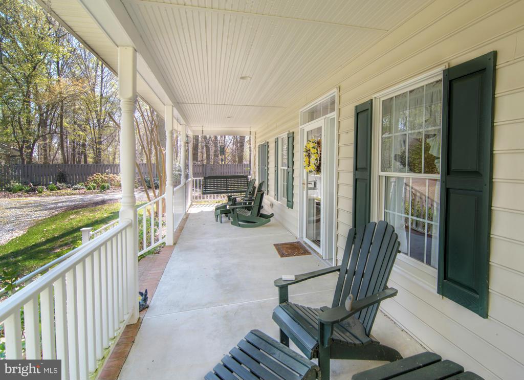 29125 Ricks Landing Road Kennedyville, MD 21645 - Photo 18 of 30 Front porch from swing looking toward garage end.