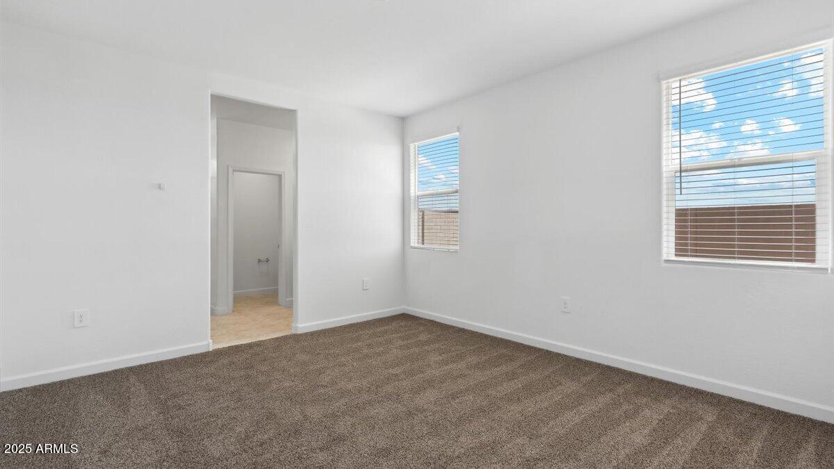 2127 Starkey Avenue Apache Junction, AZ 85120 - Photo 9 of 17 an empty room with windows