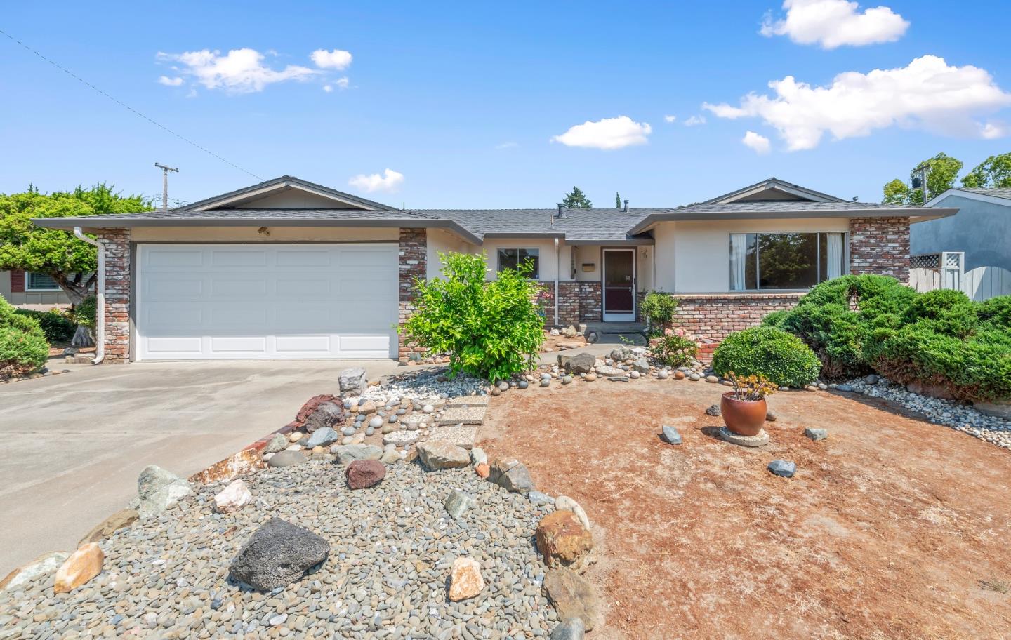 1651 Salisbury Drive San Jose, CA 95124 - Photo 1 of 22 a front view of a house with a yard and potted plants