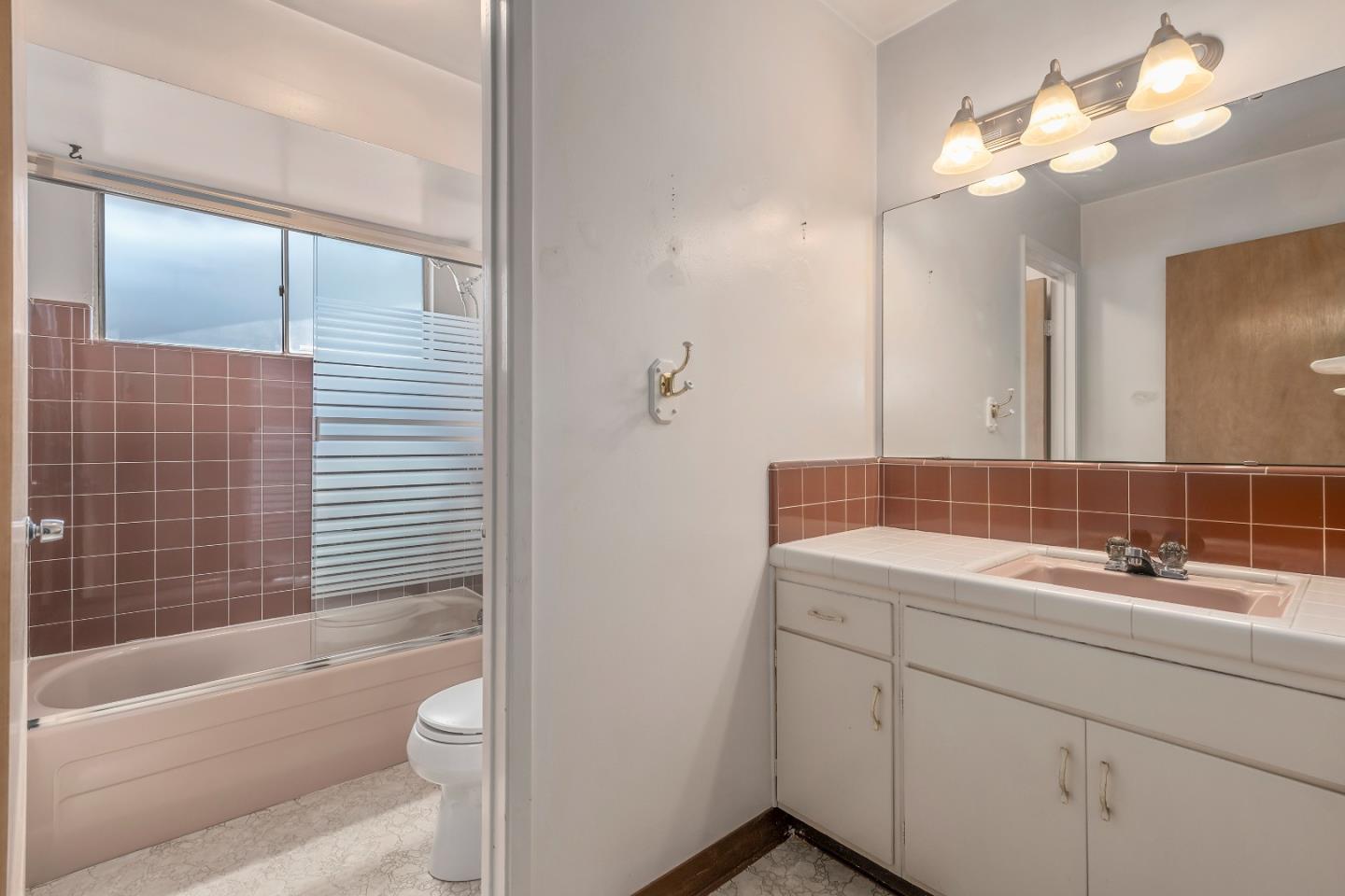 1651 Salisbury Drive San Jose, CA 95124 - Photo 12 of 22 a bathroom with a sink a toilet and shower