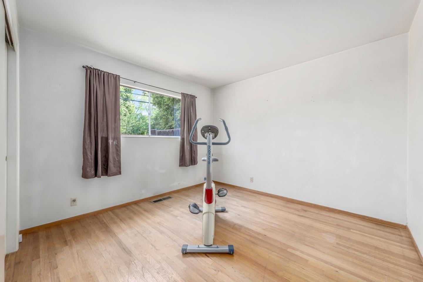 1651 Salisbury Drive San Jose, CA 95124 - Photo 13 of 22 a view of a livingroom with wooden floor and window