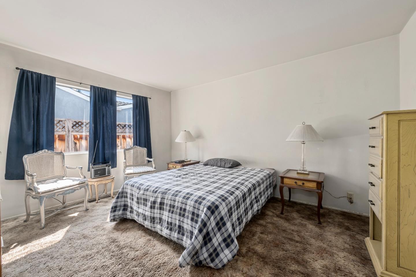 1651 Salisbury Drive San Jose, CA 95124 - Photo 14 of 22 a bedroom with a bed and a chair with the wooden floor