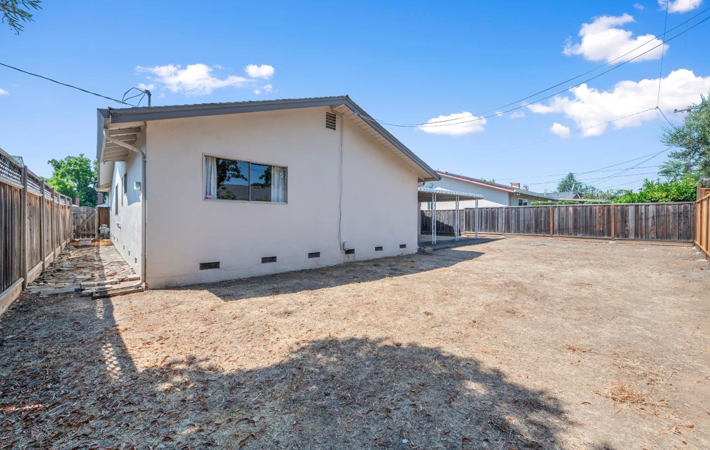 1651 Salisbury Drive San Jose, CA 95124 - Photo 19 of 22 a view of a house with a wooden fence