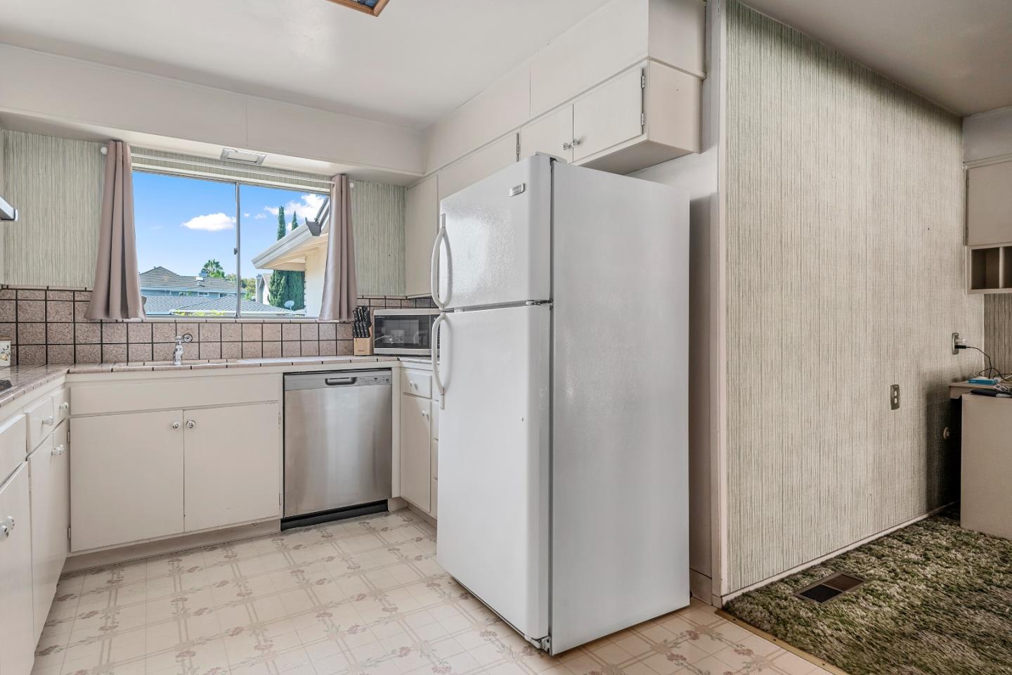 1651 Salisbury Drive San Jose, CA 95124 - Photo 7 of 22 a kitchen with white cabinets and white appliances