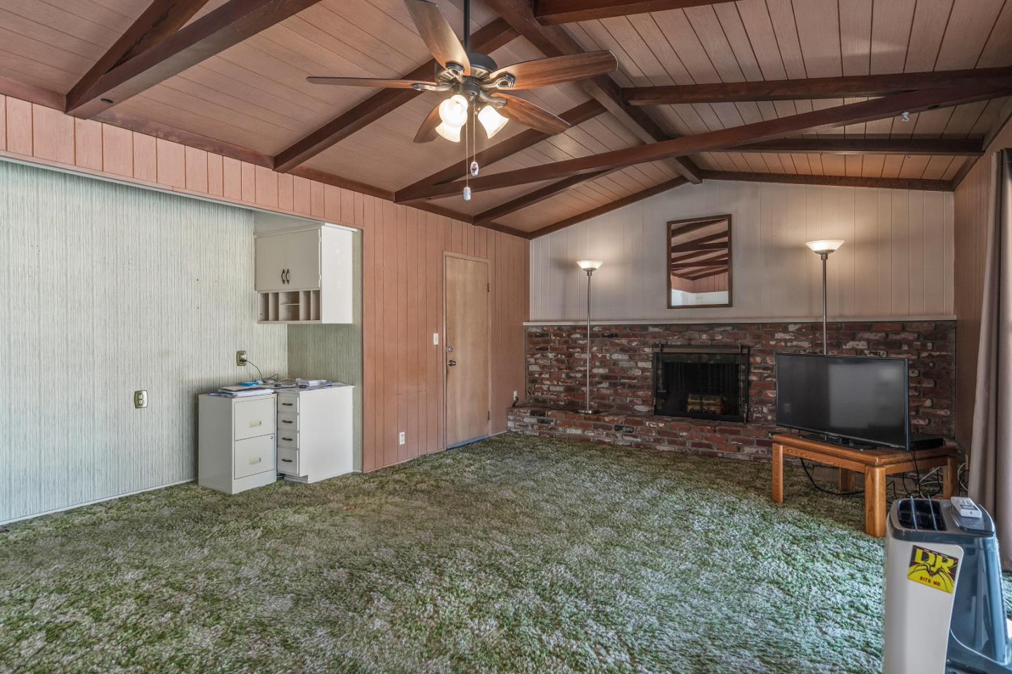 1651 Salisbury Drive San Jose, CA 95124 - Photo 8 of 22 a living room with furniture and a fireplace