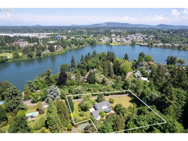 an aerial view of lake residential houses with outdoor space and lake view