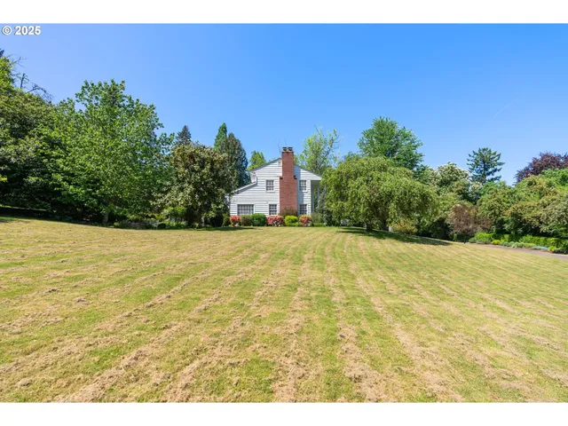 a view of a swimming pool with an outdoor space and seating area