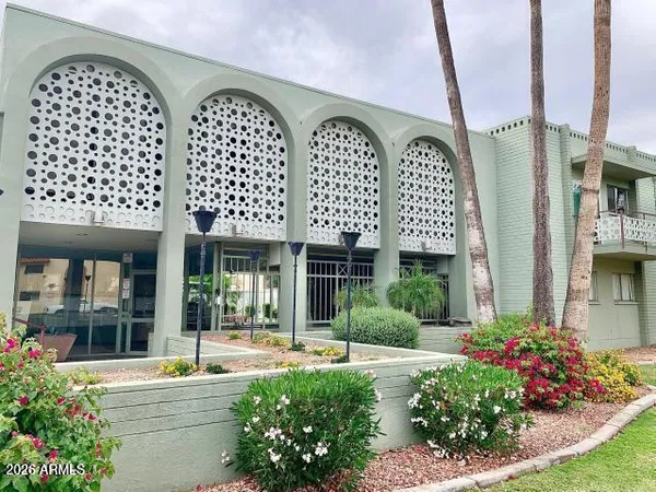 a house with a plant in front of it