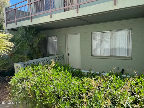 a kitchen with stainless steel appliances granite countertop a refrigerator a stove and a sink