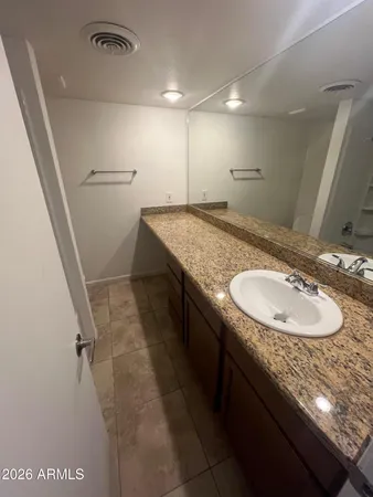 a bathroom with a tub and sink