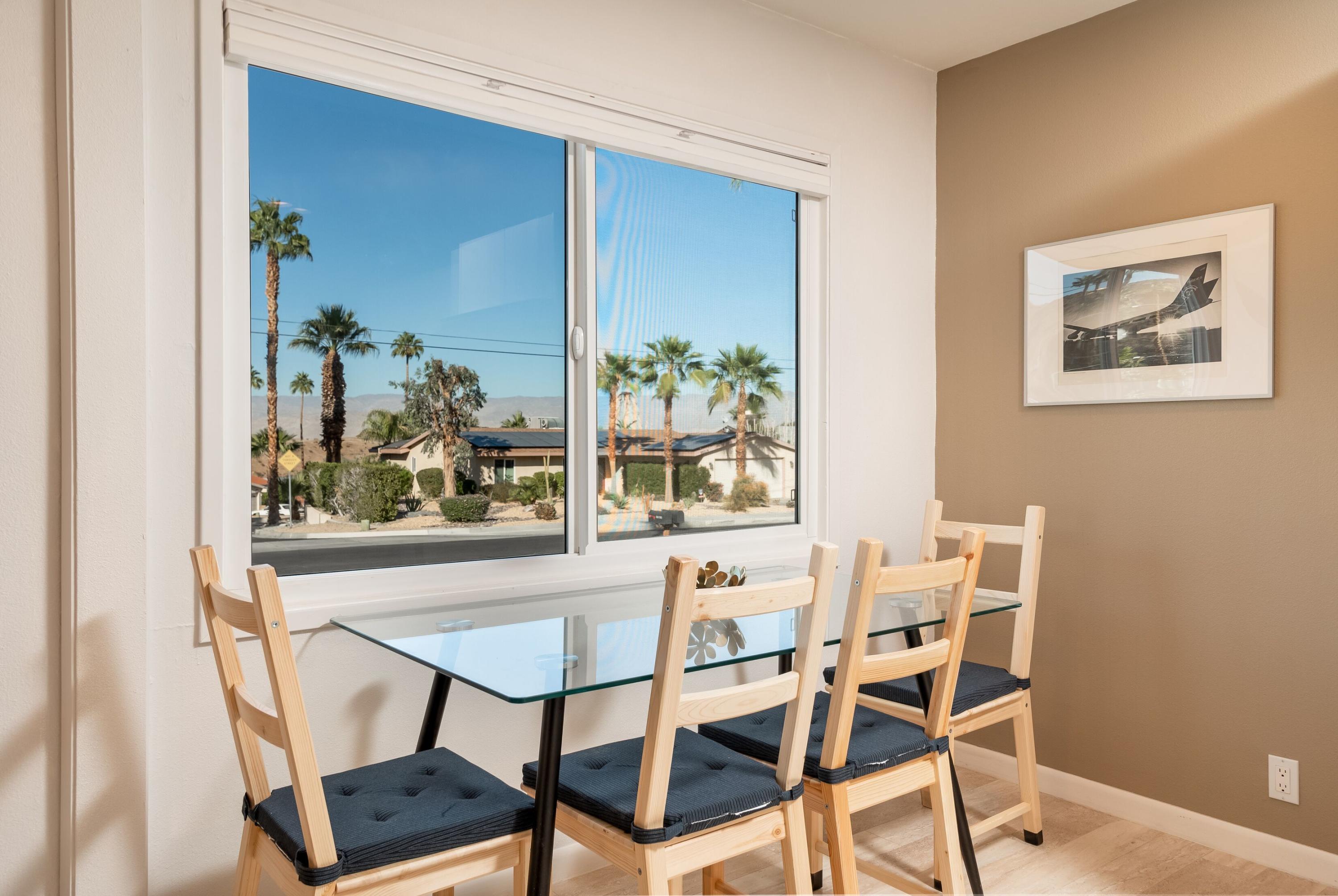 68195 Terrace Road Cathedral City, CA 92234 - Photo 14 of 33 a view of a dining room with furniture and window