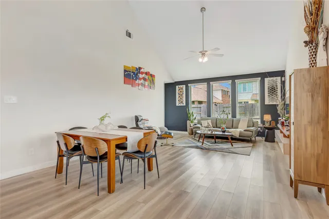 a view of a dining room with furniture window and wooden floor
