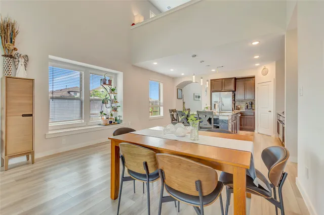 a dining room with furniture and window