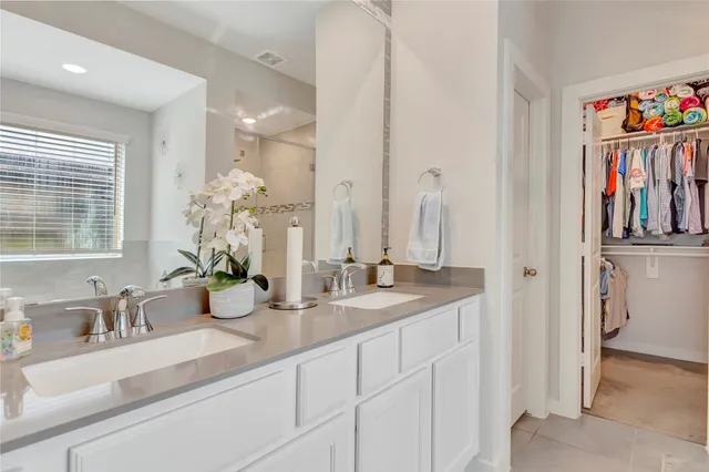 a bathroom with sink and mirror