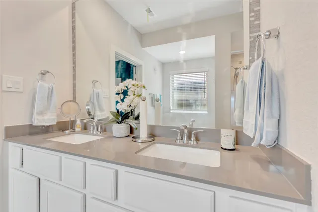 a bathroom with sink and mirror